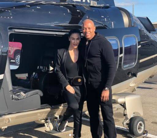 Tyra Young father Dr. Dre with Nicole Young on their 22nd anniversary.